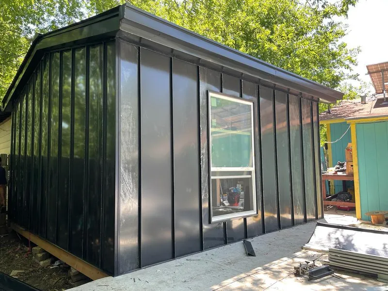 Black standing seam metal wall panels for Roof Inspection in Lenexa